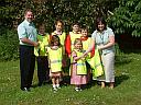 Village school children receive safety bibs from the power station, click for a bigger picture.
